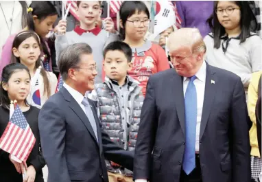  ?? PICTURE: REUTERS ?? US President Donald Trump and South Korea’s President Moon Jae-in attend a welcoming ceremony at the Presidenti­al Blue House in Seoul yesterday.