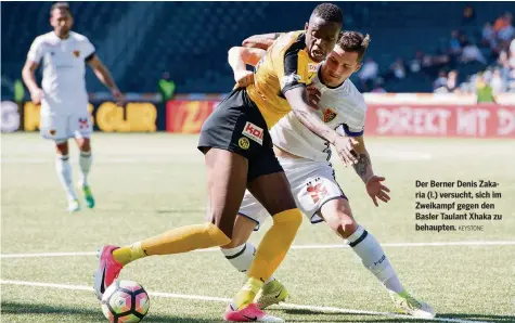  ?? KEYSTONE ?? Der Berner Denis Zakaria (l.) versucht, sich im Zweikampf gegen den Basler Taulant Xhaka zu behaupten.