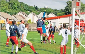  ?? 06_a32ABC08 ?? A stramash in the box during the Red Star-Oban Saints final.