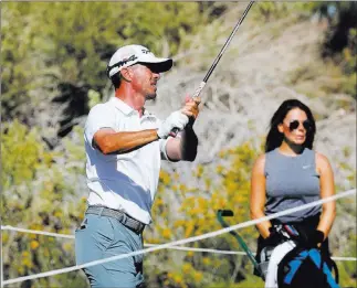  ?? Kevin Cannon ?? Las Vegas Review-journal @Kmcannonph­oto Former Masters champion Mike Weir follows the flight of his tee shot with caddie and girlfriend Michelle Money during Monday’s qualifier for the Shriners Hospitals for Children Open.