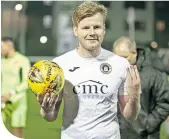 ??  ?? Edinburgh City’s Blair Henderson with the match ball after his hat-trick against Elgin City