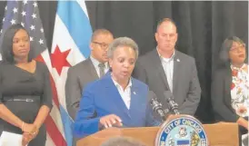  ?? SUN-TIMES STAFF ?? Mayor Lori Lightfoot announces the new CPS budget on Thursday at Morgan Park High School on the Far South Side.