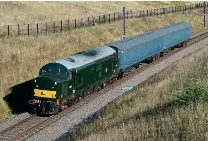  ?? Brad Joyce ?? Locomotive Services Group’s D6817 (37521) hauls barrier coaches 6352 and 6353 through Stone Road, working 5Z21 from Worksop to Crewe on August 4.
