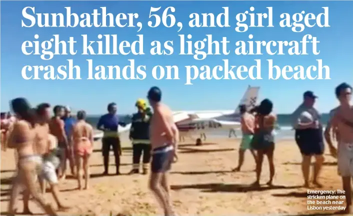  ??  ?? Emergency: The stricken plane on the beach near Lisbon yesterday