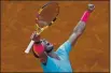  ?? ALESSANDRA TARANTINO — THE ASSOCIATED PRESS ?? Spain’s Rafael Nadal celebrates winning a semifinal match at the French Open against Argentina’s Diego Schwartzma­n in three sets in Paris on Friday.