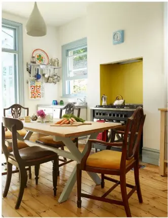  ??  ?? COUNTRY STYLE Madeleine has created a relaxed, vintage vibe in the kitchen with freestandi­ng cabinets from Ikea and shelving to display the family’s beautiful finds. The couple created the niche in the chimney breast for the cooker and a concealed...