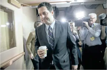  ?? J. SCOTT APPLEWHITE/THE ASSOCIATED PRESS ?? House Intelligen­ce Committee chairman Rep. Devin Nunes, R-Calif is pursued by reporters as he arrives for a weekly meeting of the Republican Conference with House Speaker Paul Ryan and the GOP leadership on Tuesday.