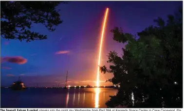  ?? (AP/Florida Today) ?? The SpaceX Falcon 9 rocket streaks into the night sky Wednesday from Pad 39A at Kennedy Space Center in Cape Canaveral, Fla., with an all-amateur crew aboard a Dragon capsule.