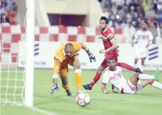  ??  ?? Oman’s Abdulaziz al Maqbali’s effort goes wide.