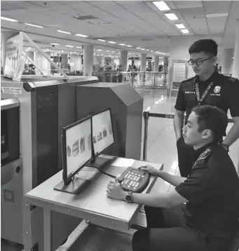  ?? CONTRIBUTE­D PHOTO ?? HEIGHTENED SECURITY. The Bureau of Customs installed seven new hand-carry x-ray machines in the three terminals of the Ninoy Aquino Internatio­nal Airport (NAIA) in a bid to strengthen vigilance in airports.
