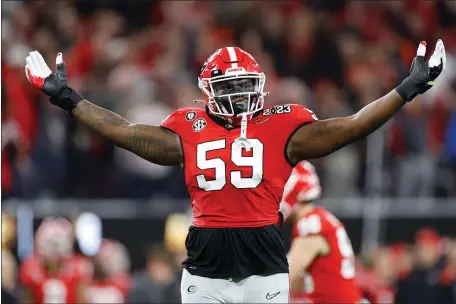  ?? STEPH CHAMBERS — GETTY IMAGES ?? INGLEWOOD, CALIFORNIA - JANUARY 09: Broderick Jones #59 of the Georgia Bulldogs celebrates after a touchdown in the second quarter against the TCU Horned Frogs in the College Football Playoff National Championsh­ip game at SoFi Stadium on January 09, 2023 in Inglewood, California.