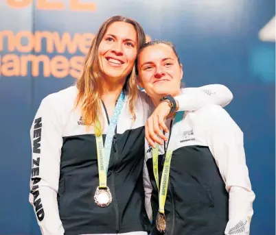  ?? Photo / Photosport ?? Joelle King, left, and Amanda Landers-Murphy wrapped up New Zealand’s campaign with squash doubles gold.