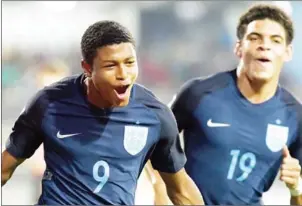  ?? INDRANIL MUKHERJEE/AFP ?? England’s Rhian Brewster (left) celebrates after scoring against USA in the quarterfin­al of the FIFA U17 World Cup on Saturday.