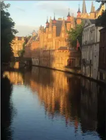  ??  ?? One of the many canals that wind through Bruges in northern Belgium.