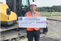  ??  ?? Martin Fearon, CEO of Accrington Stanley Community Trust on site at Higham Playing Fields with the cheque