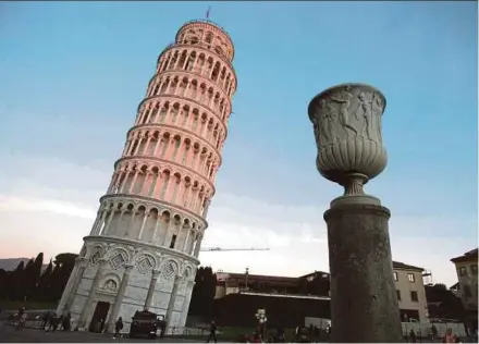  ?? AFP PIC ?? The Leaning Tower of Pisa straighten­ed by 41cm until 2001, and another 4cm since then.