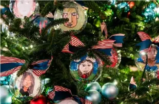  ?? Demetrius Freeman/Washington Post ?? Self-portraits of students of the 2021 Teachers of the Year from across the country were fashioned into ornaments.