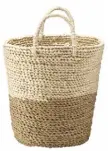  ??  ?? A two-tone woven basket, like this Maise design by Gray &amp; Willow, £28 from House of Fraser, looks good with wood tones andis perfect for storing throws or cushions