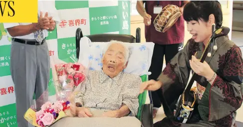  ?? KIKAI TOWN VIA / JIJI PRESS / JAPAN OUT / AFP/ GETTY IMAGES ?? Nabi Tajima, shown in this photograph from September, has died. The resident of the Japanese island of Kikai was the world’s oldest person. She attributed her long life to “eating delicious things and sleeping well.” Half of all people in the world...