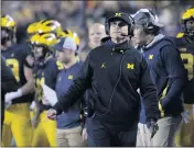  ?? TONY DING — THE ASSOCIATED PRESS ?? Michigan coach Jim Harbaugh, who is 0-5against Ohio State, is hoping for a different result on Saturday.