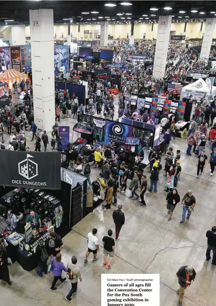  ?? Kin Man Hui / Staff photograph­er ?? Gamers of all ages fill the Convention Center for the Pax South gaming exhibition in January 2020.