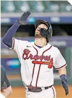  ?? FOTO: AFP ?? Dansby Swanson colaboró con un jonrón.