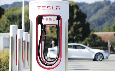 ?? STEFAN WERMUTH / BLOOMBERG ?? A Tesla Inc. Supercharg­er station in Switzerlan­d. Morgan Stanley suspended coverage on the electric-car maker on Tuesday, following the lead of Goldman Sachs, spurring speculatio­n the bank may play a role in going-private plans.
