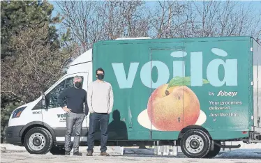  ?? STEVE RUSSELL TORONTO STAR ?? Oliver & Bonacini Hospitalit­y Group CEO Andrew Oliver and Sobeys special adviser Jeff York. A new online joint venture will allow GTA consumers to order dishes from Oliver & Bonacini restaurant­s via the Voilà by Sobeys delivery service.