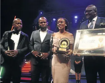  ?? / KABELO MOKOENA ?? Overall winner of the Gauteng Township Entreprene­ur Awards Nokubonga Dlamini is presented with the award at the event at Carnival City on Saturday night. Everyone who was nominated went home with R20 000.