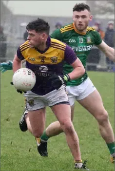  ??  ?? Corner-back Liam O’Connor surveys his options after beating Jordan Morris of Meath to the ball.