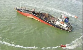  ??  ?? South Korean Coast Guard boats move around the cargo ship after an explosion in waters off South Korea’s western port city of Incheon yesterday. The Yonhap news agency reported that the explosion was more than likely caused by gases leaking from the...