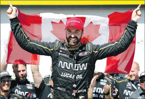  ?? — AP ?? James Hinchcliff­e of Oakville, Ont., celebrates after winning the IndyCar race at Iowa Speedway yesterday.