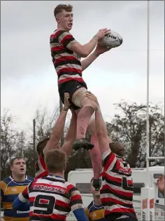  ??  ?? Enniscorth­y’s Nick Doyle, who is expected to line out at midfield for Starlights in Sunday’s Co. Senior football final, goes high to win this ball in the line-out.