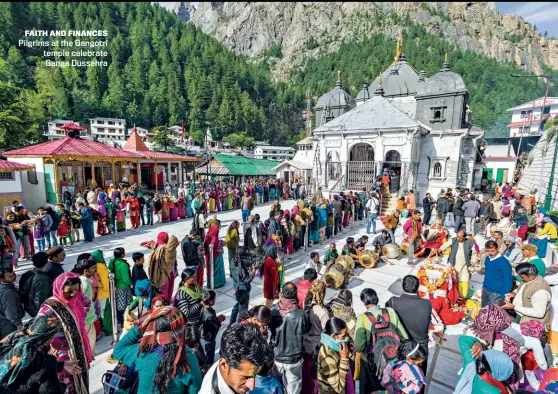  ?? FRANK BIENEWALD/GETTY IMAGES ?? FAITH AND FINANCES
Pilgrims at the Gangotri temple celebrate Ganga Dussehra