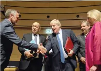  ?? PICTURE: VIRGINIA MAYO/ AP ?? British Foreign Secretary Boris Johnson, centre, shakes hands with Danish Foreign Minister Anders Samuelsen, left, during a meeting of EU foreign ministers at the EU Council building in Luxembourg yesterday.