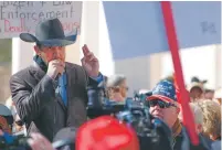  ?? MORGAN LEE/ASSOCIATED PRESS FILE PHOTO ?? Otero County Commission­er Couy Griffin speaks in Santa Fe last year during a gun rights rally.