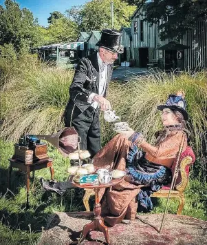  ?? PHOTO: SUPPLIED ?? Tea party . . . Steampunk NZ Trust chairman Neave Willoughby, of Christchur­ch, pours tea for his partner, Kat Douglas, on the banks of the Avon River ahead of this weekend’s Steampunk NZ Festival.