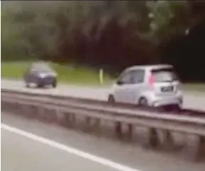  ??  ?? A screengrab of the viral video of the Perodua Myvi that was going against traffic on the North-South Expressway near the Kulai exit yesterday.