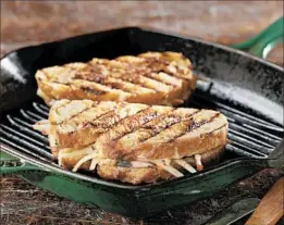  ?? ABEL URIBE/CHICAGO TRIBUNE; JOAN MORAVEK/FOOD STYLING ?? An apple and cheese, flavored with mustard and fresh thyme, panino toasts in a grill pan.