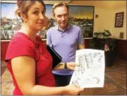  ?? EVAN BRANDT — DIGITAL FIRST MEDIA ?? Nicole and Dan McClure review a map of Second Avenue after a Phoenixvil­le Borough Council meeting at which a petition asking for traffic calming signed by 75resident­s was presented.