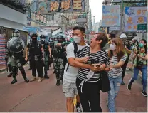  ?? KIN CHEUNG/ASSOCIATED PRESS ?? A woman argues with police Wednesday as she is told to stay away from the area in Mongkok, Hong Kong. U.S. Secretary of State Mike Pompeo has notified Congress that the Trump administra­tion no longer regards Hong Kong as autonomous.