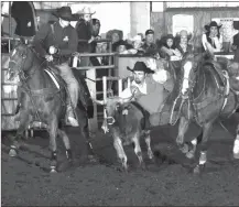  ?? DALE HIRSCHMAN ?? Will Carpenter split first and second in the short round in the steer wrestling at the Fort Scott Community College Rodeo.