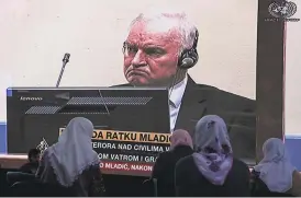  ?? Darko Bandic / Associated Press ?? Women from Srebrenica watch a live broadcast from the War Crimes Tribunal in The Hague to learn the verdict for Bosnian Serb military chief Ratko Mladic.