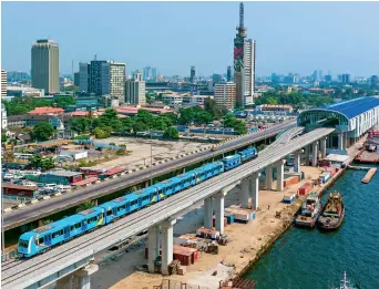  ?? ?? Photo taken on 21 December 2022 shows a train of a Chinese-built light rail project running during a completion ceremony in Lagos, Nigeria