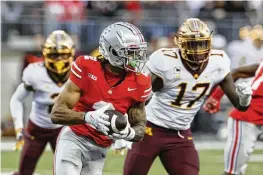  ?? JAY LAPRETE / AP ?? Emeka Egbuka is back as a receiver with a bevy of sophomores and true freshmen hoping to work their way into the rotation. Freshman Jeremiah Smith was the talk of the spring, mostly because he was impossible to ignore.