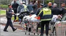  ??  ?? HORROR: Police and paramedics outside the scene of the shooting. Far left: Suspect Robert Bowers. Right: A Pittsburgh SWAT officer