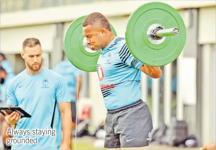  ?? Picture: JONACANI LALAKOBAU ?? Teti Tela, right, works on the weights under the watchful eyes of trainer Eroni Sotutu during a Flying Fijians team training session at Albert Park in Suva on Thursday.