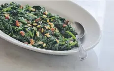  ??  ?? Spinach with Pine Nuts and Raisins.