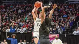  ?? ?? Preble Shawnee senior Mason Shrout is fouled during the first half Friday at UD Arena in the Arrows’ loss to Cleveland Heights Lutheran East in the Division III state semifinals. Shrout scored 18 points in his final high school game.