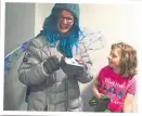  ?? PHOTO: JONATHAN MOSSE ?? Winner – Christine McKay – still wearing her dragonfly outfit, is presented with the Fairy Mary Trophy (in memory of Mary Shannon, a much loved and recently deceased boater). The judging was ably performed by children from the participat­ing boats.